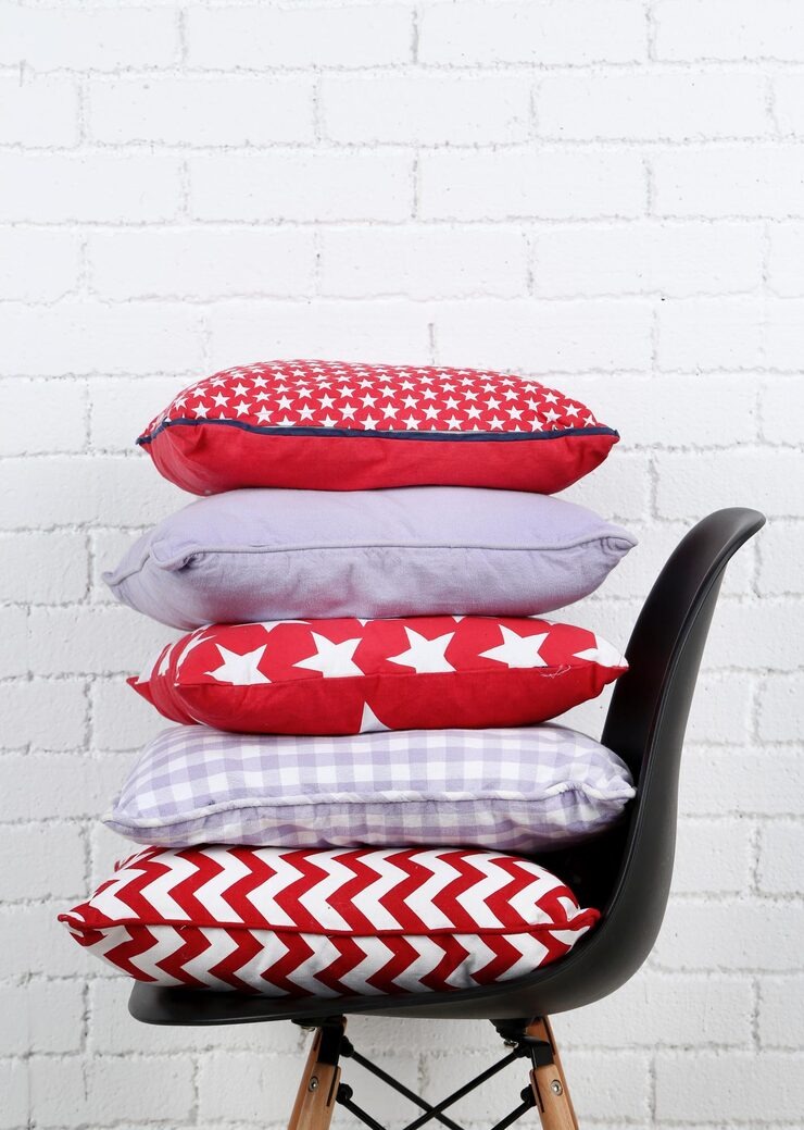 Cushions Covers Colorful Pillows Chair White Bricks Wall by Orient Uniforms for customers in Dubai, Abu Dhabi, Sharjah, Ajman and across the UAE